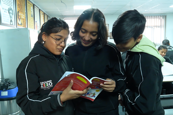 Students reading a book together