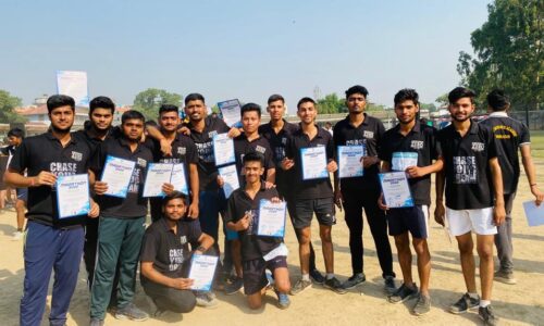 Group of Ground Zero Institute cadets holding certificates after a marathon event, posing outdoors on a sports field.